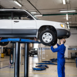 A mechanic inspecting a vehicle at an auto repair shop