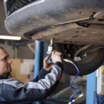 portrait-mechanic-work-his-garage